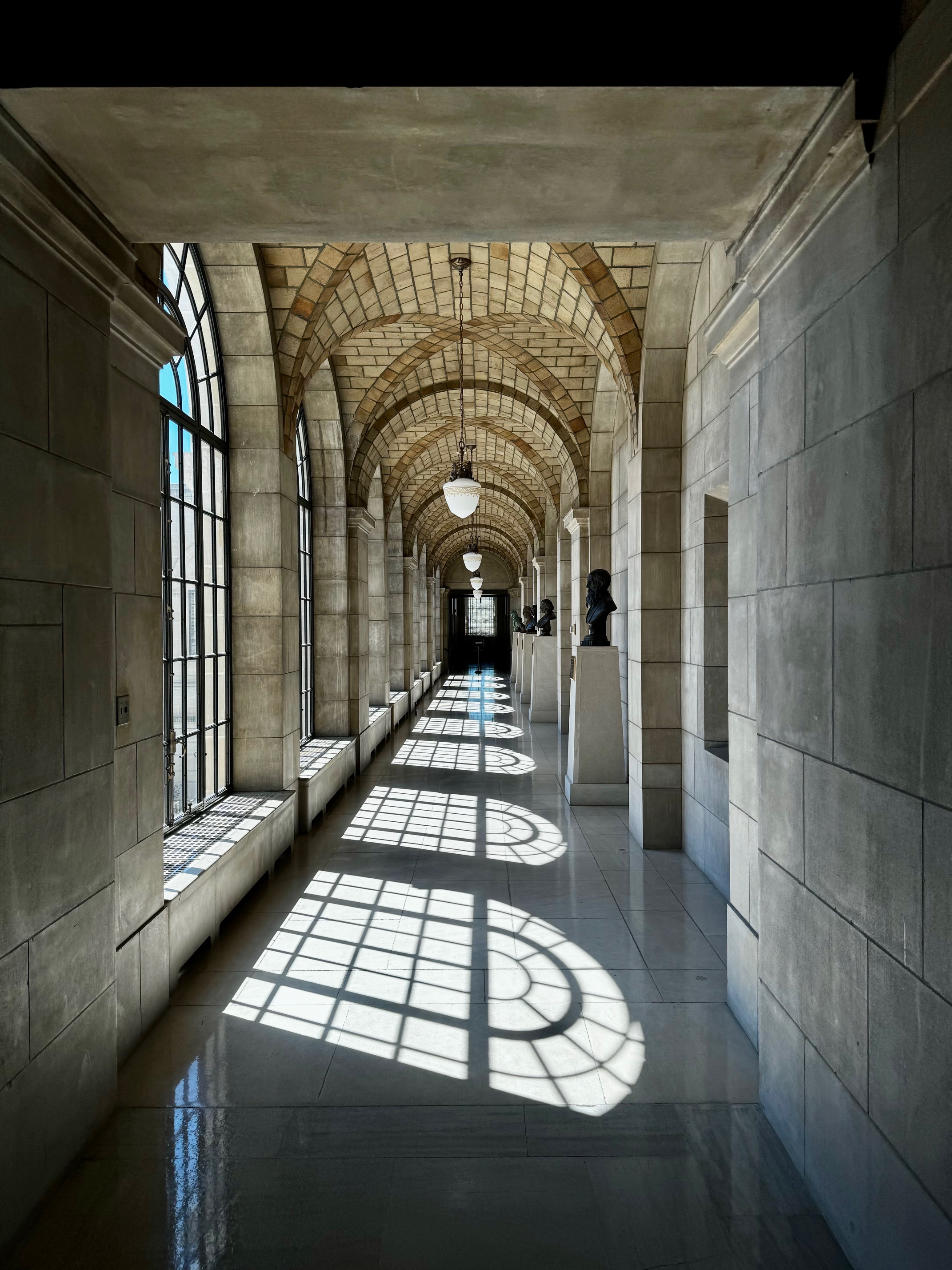 Sunlight falling through arched windows at the Nebraska State Capitol